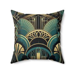 a decorative pillow with an art deco design on the front and back, along with a black background