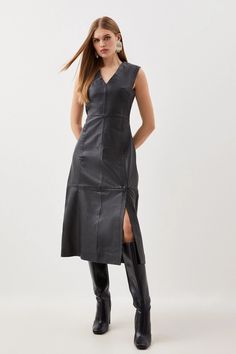 Embrace glossy texture with this premium leather dress, framed by a V-neckline and sleeveless design with extra attention to paneling for a fitted waist, and an A-line skirt with a side split for added detailing. Layer over a white shirt and pair with heeled boots for an elevated transitional ensemble. LeatherMidi dressV-necklineSleevelessSide split Sleeveless Leather Evening Dress, Elegant Leather Midi Dress, Elegant Sleeveless Leather Dress, Sleek Leather Midi Dress, Plus Size Workwear, Leather Midi Dress, Plus Size Coats, Sleeveless Midi Dress, Tailored Dress