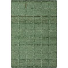 a green rug with squares and lines on the bottom, in front of a white background