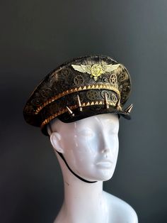 Our captain hat boasts an authentic steampunk aesthetic. Intricate gears, cogs, and spike elements adorn the hat, transporting you to an era of innovation and daring feats.


Age Group/Gender - Adult/Unisex

Size/Type - One size fits all adults

Mask Color - Gold Steampunk High Crown Mini Hat For Themed Events, Vintage High Crown Costume Hats For Cosplay, Steampunk Top Hat With High Crown For Themed Events, Steampunk Brimmed Costume Hats For Themed Events, Steampunk High Crown Hat For Themed Events, Steampunk Hat For Themed Events, Steampunk Brimmed Costume Hat For Cosplay, Steampunk Brimmed Hat For Themed Events, Adjustable Punk Costume Accessories For Themed Events