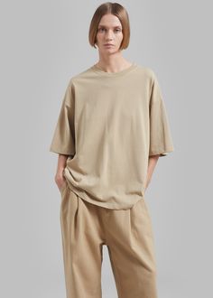 Color: Beige Midweight cotton fabric Boxy fit Crewneck Drop shoulders Slip-on style Unlined 100% Cotton Dry Clean By The Frankie Shop. Imported The Frankie Shop, Frankie Shop, Drop Shoulder, Cotton T Shirt, Cotton Tshirt, Cotton Fabric, Dry Clean, Slip On, Sleeve Length