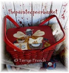 a red basket with stuffed animals in it and the words, the painted pear basket