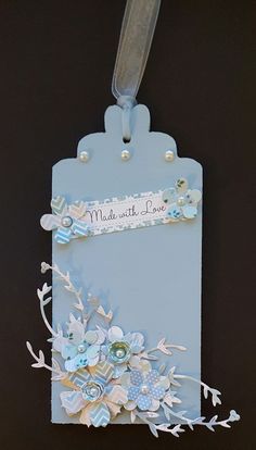 a blue tag with some flowers on it