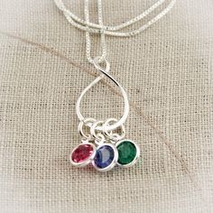 "Eternity Charm Necklace with Birthstones, Personalized Grandmother Necklace with Birthstones, Infinity Mother Necklace with Children This is a perfect necklace for a grandmother to keep her children and grandchildren close to her heart. A sterling silver eternity or infinity ring charm with birthstones to represent all of her loved ones. The infinity charm is approximately 3/4\" in diameter. --------------------------------------------------------------------------------------------- Please lis Sterling Silver Teardrop Birthday Necklaces, Sterling Silver Teardrop Necklace For Birthday, Sterling Silver Teardrop Necklace For Birthdays, Silver Oval Pendant Necklace For Birthday, Silver Oval Necklace For Birthday, Silver Infinity Necklaces With Birthstone, Silver Infinity Necklace With Birthstone, Grandmother Necklace, Mother Necklace