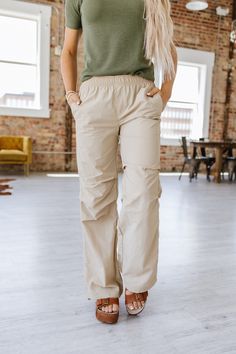 Suit up in style with Petra Parachute Pants! These pants provide a comfortable fit with their soft and lightweight parachute material that moves with your every step. Enjoy maximum freedom of movement while turning heads with their modern design! Get ready to look amazing wherever you go! Model Info: Models are 5'7", Size 2, wearing smalls Fabric: 100% nylon Versatile Summer Parachute Pants With Elastic Waistband, Versatile Parachute Pants With Elastic Waistband For Summer, Straight Leg Cargo Pants With Elastic Waistband For Outdoor, Summer Hiking Pants With Cargo Pockets, Sporty Wide-leg Cargo Pants For Spring, Athleisure Cargo Pants With Elastic Waistband For Hiking, Versatile Wide-leg Parachute Pants For Spring, Spring Outdoor Pants With Side Pockets, Relaxed Fit Cargo Pants With Elastic Waistband For Outdoor