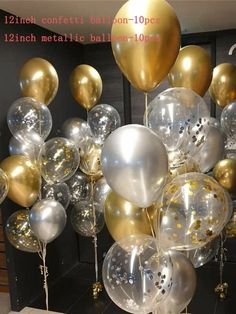 a bunch of balloons that are in front of a wall with gold and silver confetti