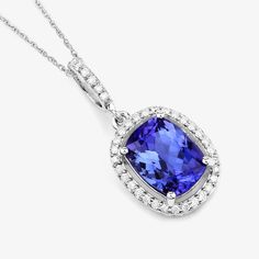 14K White Gold Tanzanite Pendant, Genuine Tanzanite and Diamond Gold Pendant Necklace, Statement Pendant, December Birthstone Pendant Stunning verdant color beautifies this fundamental symbol of beauty. A glorious halo pendant is adored with genuine cushion tanzanite gemstones totaling 2.37 carats. Set in polished 14k white gold with fine finish on a . A truly special piece for yourself or to gift for any festive milestone. , tanzanite pendant halo necklace. 14k gold tanzanite and diamond pendan Oval Tanzanite Jewelry With Gemstone Accents, White Gold Tanzanite Pendant Necklace, Tanzanite Jewelry With Accent Stones, Tanzanite Gemstone Pendant Necklace, Anniversary Tanzanite Pendant Necklace, Tanzanite Pendant Necklace For Anniversary, Tanzanite Gemstone Pendant Necklaces, Tanzanite Birthstone Necklaces For Anniversary, Wedding Tanzanite Pendant Necklace