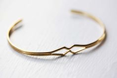 Diamond Bend Cuff Bracelet. $12.00, via Etsy. Vintage Cuff Bangle Bracelet As Gift, Vintage Bangle Cuff Bracelet As A Gift, Handmade Retro Bangle For Gifts, Retro Bangle Bracelets For Gifts, Retro Bangle Bracelets For Gift, Vintage Jubilee Cuff Bracelet As Gift, Vintage Jubilee Cuff Bracelet Gift, Retro Gold Bangle Cuff Bracelet, Retro Gold Cuff Bracelet As A Gift