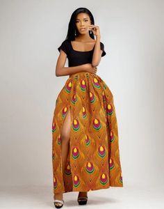 Say Hello! to our Achol maxi skirt, the African fusion skirt that will make you feel like you're living in a colourful world! With a high slit  and high waist 3 inch waist band, it's perfect for girls on the go. It's full of life and adventure and is always up for anything! Description - Pleated waistline - Side pockets  - High right slit - Back invisible zipper  - Half lined for added comfort  - 2.5 inches waist band - Floor length - Made in Cameroon - Fabric from Benin Care instructions - Hand African Skirt, Maxi Rock, African Skirts, Invisible Zipper, Waist Band, African Print, Floor Length, Maxi Skirt, Care Instructions