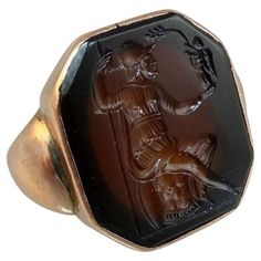 Sard intaglio of Athene holding Nike. The "large” intaglio is set in 15 ct gold ca 1820. Measurement of bezel:19 x 17 mm Size 7 Hiphop Jewelry, Estate Jewelry Rings, Winged Victory, Antique Sculpture, Ancient Jewellery, Antique Jewelry Rings, Gold Cufflinks, Brooch Necklace, Ancient Jewelry