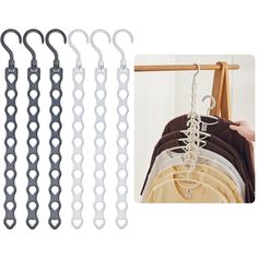 four hooks hang from a clothes rack and one is holding an item with chains on it