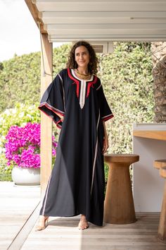 **Note : The kaftan in the video is a different color of the same kaftan and is shown to display the cut, fit, and fabric. You will receive the kaftan in the pictures.** An elegant Moroccan caftan will make you feel like African royalty. It's extremely elegant with a dash of classy cotton embroidery in the front. Ideal for plus size women as well. Made of extremely soft fabric to make you feel free and beautiful at the same time.  This Kaftan is ideal to wear for any casual occasion. Whether tak Traditional Black Free Size Kaftan, Black Kaftan For Eid, Bohemian Black Kaftan For Eid, Black Bohemian Kaftan For Eid, Traditional Long Black Kaftan, Black Tunic Kaftan For Festival, Black Festival Tunic Kaftan, Bohemian Black Thobe For Eid, Traditional Black Maxi Length Thobe