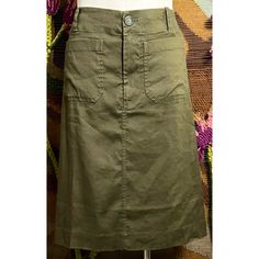 New With Tags Size Xs This Chic Olive Green Skirt Is A Part Of Anthropologie’s Coveted Colette Line. The Skirt Has Two Front Utility Pockets & 2 Back Pockets. The Fabric Is 52% Linen, 46% Viscose, & 2% Elastane. The Closure Is A Double Button & Zipper Combination With A Snap Button Next To The Button To Keep The Waist Smooth. *** The Dress Form Is Wearing A Size Medium. Please See Measurements Below For The Size Xs Fit. In One Of The Pictures The Skirt Is Paired With Anthropologie Maeve Blouse ( Casual Fitted Cargo Pencil Skirt, Fitted Green Cargo Skirt For Spring, Fitted Knee-length Cargo Skirt For Summer, Chic Knee-length Cargo Skirt For Spring, Fitted Cargo Pencil Skirt For Spring, Chic Long Fitted Cargo Skirt, Lined Knee-length Cargo Skirt, Spring Lined Cargo Skirt, Knee-length Lined Cargo Skirt