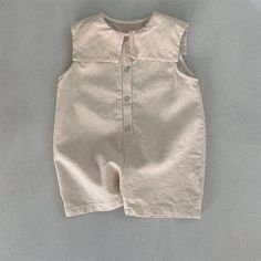 This Sleeveless Button-Down Jumpsuit is perfect for your little fashionista! ✨ Made from soft, breathable cotton, this adorable jumpsuit features a classic button-down design and a comfortable mid-waist silhouette. Whether your little one is playing in the park or attending a special event, this jumpsuit will keep her looking and feeling stylish all day long. 🌸 #kidsfashion #summerstyle #buttondownjumpsuit Specifications: Material: Cotton Fit: Fits true to size, take your normal size Waist Type Sleeveless Cotton Jumpsuits And Rompers In Solid Color, Summer Cotton Bubble Romper With Button Closure, Casual Fitted Sleeveless Bubble Romper, Fitted Sleeveless Casual Bubble Romper, Summer Button-up Jumpsuits And Rompers, Sleeveless Cotton Jumpsuit With Buttons, Solid Color Cotton Jumpsuits And Rompers With Buttons, Solid Cotton Jumpsuits And Rompers With Buttons, Summer Button-up Solid Color Jumpsuit