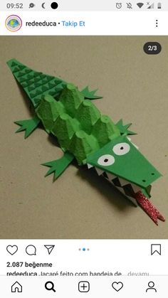 an origami crocodile made out of paper on top of a table with the caption rededuca talkin