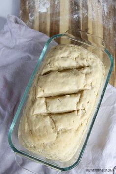 a loaf of bread in a glass baking dish