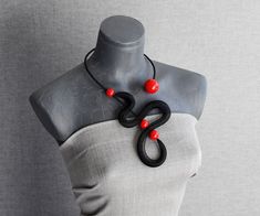 Adjustable Black Bib Necklace As Gift, Adjustable Black Bib Necklace For Gifts, Adjustable Black Bib Necklace For Gift, Unique Black Pendant Necklace, Modern Handmade Necklaces For Party, Modern Black Handmade Necklace, Modern Red Necklace For Party, Unique Black Party Necklaces, Unique Black Necklaces For Party