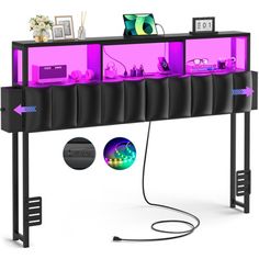 a black shelf with purple lights on it