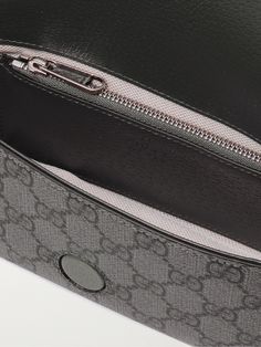 Gucci's 'Ophidia' bag has achieved cult status since its release in 2018. This mini version is crafted from coated-canvas printed with signature 'GG' motif and trimmed with leather. It's perfectly sized to hold the essentials like your phone, cardholder and keys. Formal Shoulder Bag With Removable Pouch In Monogram Canvas, Formal Monogram Canvas Shoulder Bag With Removable Pouch, Formal Monogram Canvas Pouch Shoulder Bag, Gucci Top Handle Shoulder Bag With Dust Bag, Gucci Pouch Bag With Dust Bag Included, Luxury Monogram Canvas Clutch Bag, Gucci Shoulder Bag With Removable Pouch, Designer Gucci Pouch Bag, Gucci Pouch Bag With Detachable Strap