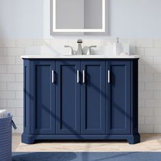 a blue bathroom vanity with three stars above it and the words, louis's