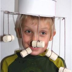 a young boy with marshmallows attached to his head