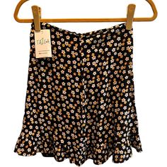 Tazga Retro Daisy Black Skirt Size: S Color: Black And Multicolored Flowers Condition: Never Worn And In Perfect Condition. Super Cute Skirt I Bought But Just Never Ended Up Wearing. Very Light Weight Material. Black Floral Print Mini Bottoms, Black Floral Print Mini Length Bottoms, Black Skort For Spring Vacation, Black Mini Skirt For Vacation, Black Short Skirt For Vacation, Casual Black Flowy Shorts, Lululemon Tennis Skirt, Multicolored Flowers, Lululemon Skirt