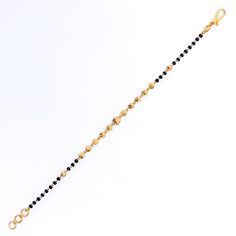 Weighing 4.3 grams, this 22k gold bracelet showcases a graceful yet jazzy design with black bead accents set against a radiant yellow gold finish. The 7.2-inch length, coupled with adjustable 0.6-inch links, ensures a perfect fit for any wrist. Secured by a hook lock, this bracelet offers a beautiful blend of traditional charm and modern flair, making it a versatile piece for both everyday wear and special occasions. PRODUCT DETAILS Gold Purity(karat): 22k Item Weight(grams): 4.3 Item Finish: Ye Elegant Yellow Gold Bracelets With Black Beads, Elegant Yellow Gold Bracelet With Black Beads, Black Bracelets For Festivals, Black Festive Bracelets For Festivals, Black Bangle Bracelets For Festive Occasions, Festive Black Bangle Bracelets, Festive Black Bangle Bracelet, Black 22k Gold Jewelry With Round Beads, Traditional Gold Bracelet With Black Beads