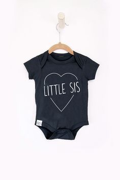 Little sis onesie for baby girl. Grab a matching set for your crew with the rest of our Big + Little tee's. Summer Cotton Stretch Onesie, Unisex Casual Short Sleeve Bodysuit For Playwear, Casual Stretch Onesie For Playwear, Casual Cotton Short Sleeve Crew Neck Bodysuit, Cute Cotton Onesie For Loungewear, Playful Cotton Short Sleeve Bodysuit, Cotton Short Sleeve Bodysuit For Playwear, Summer Cotton Short Sleeve Bodysuit With Crew Neck, Summer Cotton Short Sleeve Crew Neck Bodysuit