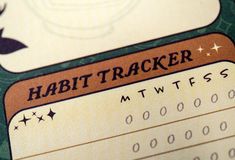 a close up of a ticket with the word habittracker on it