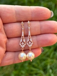 These are beautiful bridal earrings.  Made to order, fast shipping! 💕rose gold plated over brass components with cubic zirconia crystals, Swarovski  cream pearls 💕earrings are approx 2 inches or 5 cm  top to bottom  Thank you so much for your custom! Elegant Rose Gold Earrings For Wedding, Elegant Rose Gold Bridal Earrings For Wedding, Rose Gold Cubic Zirconia Pearl Earrings For Anniversary, Rose Gold Cubic Zirconia Bridal Earrings For Wedding, Rose Gold Elegant Bridal Earrings, Elegant Rose Gold Bridal Earrings With Elegant Design, Elegant Rose Gold Bridal Earrings, Rose Gold Cubic Zirconia Dangle Pearl Earrings, Classic Rose Gold Bridal Earrings For Wedding