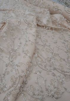 "Luxury embroidered lace fabric for wedding gown. Lace fabric with overlaid elements. 3D effect lace is a fabric of incredible magic. Delicate design with small flowers, embellished with beads and sequins. Such fabric will help to bring to life a completely graceful and sensual image of the bride. Lace width( 53\") 1.35 m. The price is for: 1) 0.5 yard - 82$ 2) 1 yard - 155$ Composition: 50% nylon, 50% polyester Width 1.35 (53 \") You can pick up the buttons in the color of the fabric here: http Elegant Lace Fabric With 3d Embroidery, Elegant Organza Wedding Dress With Floral Embroidery, Elegant Organza Fabric With 3d Embroidery, Cream Organza Fabric With Intricate Embroidery, Cream Organza With Intricate Embroidery, Cream Embroidered Organza Fabric, Wedding Dress With 3d Embroidery In Organza, Elegant Silver Embroidered Organza Fabric, Elegant Cream Embroidered Fabric With 3d Embroidery