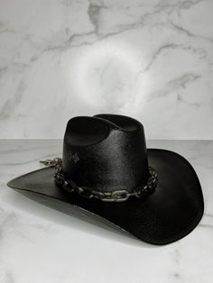 "The Dark Horse hat is Howdy Mear's most popular style as it goes with everything and can be dressed up or down. Great for a bachelorette weekend, game day, or night out! Black cowboy hat with matte black chain. Hats come in size S/M (measures 22 1/2 inches around crown) and M/L (measures 23 3/8\" around crown). Every hat is handcrafted from start to finish. Slight variation in the appearance of each uniquely made item is to be expected." Goth Cowboy Hat, Cowboy Hat Bachelorette, Black Cowgirl Hat, Dark Cowboy, Bachelorette Cowgirl, Butterfly Stomach, Dark Western, Goth Cowboy, Cowboy Accessories