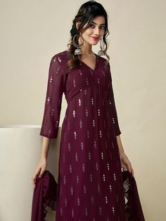 Burgundy embroidered Kurta with Palazzos with dupattaKurta design:Ethnic motifs embroideredA-line shapeRegular styleV-neck, three-quarter regular sleevesNa pockets sequinned detailKnee length length with straight hemGeorgette machine weave fabricPalazzos design:Solid PalazzosPartially elasticated waistbandSlip-on closure Western Kurtis, Ethnic Motifs, Salwar Kameez Online, Blouse Sale, Net Dupatta, Teal And Pink, Teal And Gold, Kurta Designs, Pink Silk