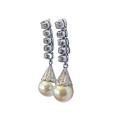 Superb and elegant Ladies Cultured Pearl & Diamond Stud  Dangle Earrings  14K White  Gold each set with 8mm medium grade capped yellowy creme colored cultured pearl, accented with five diamonds. 1 full cut @ 2.4mm 05 points and 4 single cuts @ 1.8mm 02 1/2 points L colors VS clarities ,Gold weight = 4.5 dwt / 6.99grams  1.25" approx long by 0.25" w by 0.50" D amazing in person  thanks Formal Pear Shaped Diamond Pearl Earrings, High Luster Diamond Earrings For Formal Occasions, Formal Pear-shaped Diamond Pearl Earrings, Classic Diamond Drop Pearl Earrings, Classic Dangle Diamond Earrings For Evening, Classic Evening Dangle Diamond Earrings, Formal High Luster Pear-shaped Earrings, Classic Diamond Teardrop Pearl Earrings, Classic Teardrop Diamond Pearl Earrings