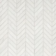 a white marble herringbone tile pattern