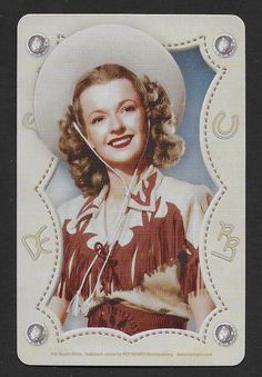 an old photo of a woman wearing a cowboy hat