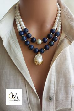 A timeless accessory that embodies natural beauty, our elegant Pearl and Lapis Lazuli Necklace combines lustrous freshwater pearls, known for their lustrous and iridescent appeal, with the deep blue appeal of genuine Lapis Lazuli gemstones. Handmade with love and attention to detail, this stunning necklace exudes a sense of opulence and elegance. Elegant Single Strand Beaded Necklace, Elegant Long Crystal Necklace For Gift, Elegant Long Necklaces For Weddings, Elegant Double Strand Gemstone Beads Necklaces, Double Strand Pearl Necklace With Natural Stones, Spiritual Pearl Jewelry With Gemstone, Long Gemstone Necklace For Formal Occasions, Exquisite Gemstone Bridal Necklace, Elegant Single Strand Blue Jewelry