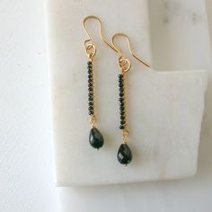 "A modern and linear pair of earrings made with a wire wrapped black onyx bar suspends a teardrop of the same stone. Earrings shown in 14k gold fill, also available in sterling silver and rose gold fill. Earrings measure approximately 2\".  I use only the finest quality materials to make my pieces. Each stone is carefully selected and I never use plated materials. All chains, wires and findings are sterling silver or 14k gold fill. I guarantee all of my work, including materials as well as the c Onyx Bar, Wrapped Earrings, Earrings Wire, Earrings Inspiration, Earrings Black, Black Earrings, Bar Earrings, Lovely Earrings, Gift Jewelry