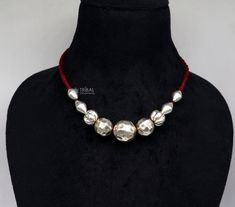 This exquisite 925 silver beaded necklace is a timeless accessory that exudes elegance and sophistication. Crafted from high-quality sterling silver, each bead showcases a radiant shine, adding a touch of luxury to any ensemble. The necklace features a single strand of meticulously crafted silver beads, delicately arranged to create a seamless and captivating design. The beads are perfectly smooth and polished, reflecting light with every movement and creating a dazzling effect. Metal-925 sterli Silver Round Beaded Metal Necklace, Silver Beaded Necklace With Polished Beads, Silver Metal Beaded Necklaces With Round Beads, Silver Round Necklaces For Festive Season, Festive Silver Necklaces, Round Silver Necklaces For Festive Season, Silver Beaded Sterling Silver Jewelry, Festival Metal Jewelry With Large Beads, Silver Necklaces With Polished Beads