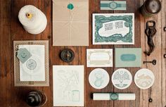 various stationery items laid out on a wooden table