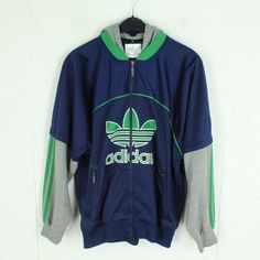 Brand: Adidas Product: Tracksuit jacket Details: multicoloured, with logo stitching, 90s, zip, hood Men's size: S single chest width: 55 cm Arm length: 50 cm simple shoulder width: 50 cm Length: 62cm Condition: very good, used Material: 100% polyester; sleeves + hood: 60% cotton, 40% polyester 14 days right of withdrawal free store pick up in Berlin If you have any questions, please contact us by phone or email. We are happy to help you Monday to Saturday from 12:00 p.m. to 6:00 p.m. Please also note the dimensions as the sizes vary depending on the manufacturer. If you don't like or fit a product, you can of course cancel your order and send it back to us. Please note our terms and conditions and the cancellation policy. By buying used clothing, you are acting sustainably, protecting our Sporty Green Outerwear With Embroidered Logo, Green Cotton Track Jacket For Streetwear, Green Athleisure Tracksuit For Streetwear, Sporty Green Winter Tracksuit, Sporty Hooded Track Jacket For Jogging, Green Cotton Sporty Track Jacket, Green Cotton Track Jacket, Green Track Jacket For Streetwear Athleisure, Green Sporty Track Jacket For Streetwear