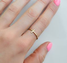 Our gold cross ring is a dainty and minimalist accessory for women of faith. Crafted from high-quality gold filled material, this versatile ring can be worn on your pointer finger, index finger, or thumb. Express your Christian beliefs in style with this elegant crucifix ring. Rings are sold in sizes 5 6 7 8 9 10  PRODUCT DETAILS * Ring is solid 925 sterling silver, 14k goldfill or 14k rose goldfill * Width of band measures 2mm  * Comes beautifully packaged in a gift box SHIPPING and POLICIES * Pointer Finger Ring, Christian Rings, Gold Cross Ring, Rings Minimalist, Minimalist Accessories, Index Finger, Detailed Ring, Gold Ring Stack, Cross Ring