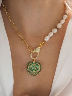 Freshwater gold chunky necklace Length is  40cm/16''  but you can choose other length from the drop down menu     This  necklace made half  from freshwater pearl Gold  chain  and  the other half from gold lik chain  In the middle of this  hangs one green micropave zirgon heart   It is incredibly elegant jewelry  , that you can wearing it non stop with all of your outfits. Also  it is  a perfect long distance gift for her to express your love.   How to wear : With white Shirt V neck * Please note that   product colour may vary from colors shown on your monitor. *This Listing is only for one necklace purchase. * * *Gift wrapping and packaging All orders come gift wrapped into a cute metatilic round box .If you have ordered more than one item will be wrapped all together unless you advise me Chunky Chain Heart Pendant Necklace As Gift, Chunky Chain Heart Pendant Necklace For Gift, White Pearl Necklace With Chunky Chain For Gift, Pendant Pearl Necklace With Chain As Gift, Gold Plated Chain Pearl Necklace As Gift, Green Chunky Chain Necklace As Gift, Gold Chunky Necklace, Pearl Gold Chain, Pearl Necklace Freshwater