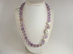 "Chunky amethyst and white pearl statement necklace, multi strand statement purple  necklace, beaded necklace, big violet  beads, amethyst  statement jewelry matching earrings, BEST SELLER Spring 2022 Fashion A bold and dramatic statement necklace featuring genuine amethyst  gemstone  beads and baroque freshwater pearls , medium weight Measurements: 19\" (478cm) plus 4\" extender Contains small parts! Not for children! Choking Hazard! Each piece of jewelry from my shop comes beautifully packaged Purple Pearl Jewelry With Gemstone Beads, Purple Pearl Jewelry With Natural Stones, Lavender Single Strand Jewelry With Round Beads, Elegant Single Strand Amethyst Beaded Necklace, Purple Pearl Single Strand Jewelry, Lavender Single Strand Round Bead Jewelry, Purple Single Strand Pearl Jewelry, Purple Amethyst Pearl Necklace, Elegant Purple Round Beaded Necklaces