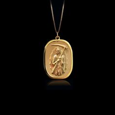 Our Gold Santa Muerte Pendant, crafted in the USA from real solid gold, embodies devotion and protection. This timeless piece showcases exquisite craftsmanship, designed to last a lifetime. Perfect for those seeking a unique and meaningful symbol, this pendant is a testament to enduring quality and elegance. PENDANT INFORMATIONThis pendant is made of real, solid gold.• Made in USA• Material: 14k or 18k solid gold• Finish: polished• Height: 1.24" (31,5 mm) | *includes the small circle, bail dimen Spiritual Yellow Gold Recycled Jewelry, Spiritual Style Yellow Gold Recycled Jewelry, Spiritual Yellow Gold Jewelry In Recycled Gold, Spiritual Gold Plated Jewelry With Polished Finish, Spiritual Yellow Gold Jewelry With Polished Finish, Spiritual Hallmarked 14k Gold Jewelry, Symbolic Gold Plated Jewelry For Formal Occasions, Formal Symbolic Gold Plated Jewelry, Timeless Handmade Yellow Gold Necklaces