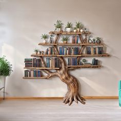 a bookshelf shaped like a tree with potted plants on it