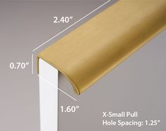 the width of a gold and white door handle with measurements for each piece on it