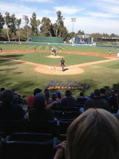 a baseball game in progress with the pitcher throwing the ball to the batter and the catcher waiting for the pitch