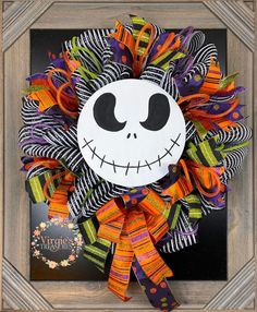 a halloween wreath with a skeleton face on it