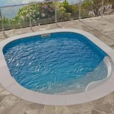 an above ground swimming pool in the middle of a patio